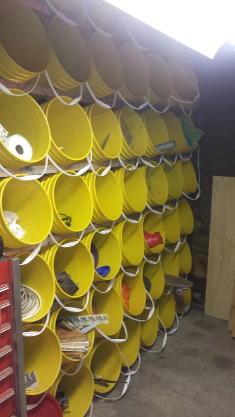 Amazing 5 Gallon bucket storage wall ideas for your garage or craft supplies. 7 x 7 for a total of 49 buckets. Removable and self supporting. Built by Sarah Haringa scaffolding pics available. Storage Wall Ideas, Shed Storage Ideas, Bucket Storage, Garage Organisation, 5 Gallon Buckets, Storage Shed Organization, Garage Workshop Organization, Shed Organization, Tool Room