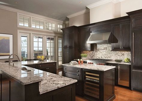 Beautiful dark wood cabinet kitchen with light color granite counters and stainless fixtures Grey Kitchen Colors, Dark Wood Kitchen Cabinets, Brown Kitchen Cabinets, Dark Wood Kitchens, Dark Wood Cabinets, Kitchen Wall Colors, Basic Kitchen, Black Kitchen Cabinets, Dark Kitchen