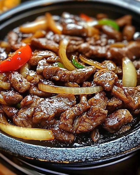 Sizzling Chinese Pepper Steak with Onions 🌶️🥩 Ingredients For the Steak Marinade: 1 lb flank steak, thinly sliced against the grain 2 tablespoons soy sauce 1 tablespoon cornstarch 1 tablespoon vegetable oil For the Stir-Fry: 2 tablespoons vegetable oil 1 large onion, thinly sliced 1 bell pepper, thinly sliced (any color) 1 green bell pepper, thinly sliced 3 cloves garlic, minced 1 tablespoon ginger, minced 1/2 cup beef broth 2 tablespoons soy sauce 1 tablespoon oyster sauce 1 tablespoon ho... Pepper Steak With Onions, Pepper Steak And Onions, Steak With Onions, Chinese Pepper Steak, Green Bell Pepper, Against The Grain, Pepper Steak, Steak Marinade, Flank Steak