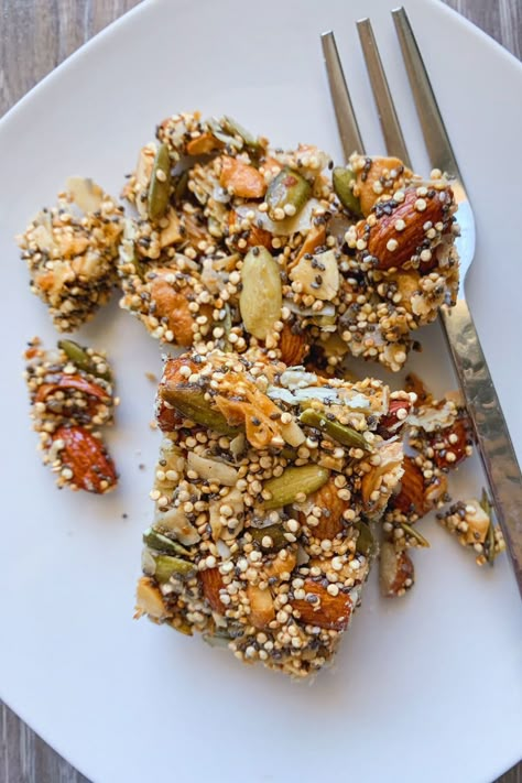 Nut and Seed Bars on a plate with a fork. Vegan Nut And Seed Bars, Seed And Nut Bars, Nut And Seed Bars, Seed Bars Recipe, Best Breakfast Bars, Seed Granola, Homemade Bars, Quinoa Bars, Breakfast Bars Healthy