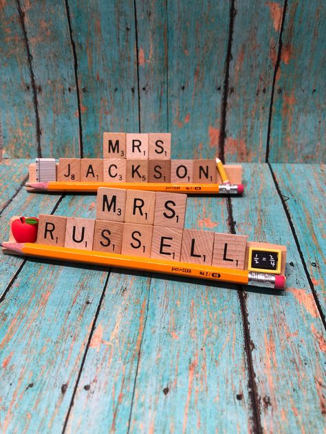 "Scrabble tile name plates customized for those special educators in your life! Added with a touch of \"school\" accents these pieces are great gifts for thanking a teacher!! These will come with pencil attached plus one or two embellishments. Don't forget a gift for that special teacher, coach, or dance instructor! Each holder can hold up to 10 letters. Scrabble tiles are a variety of new, used, vintage, & SCRABBLE LIKE TILES (some are handmade but are the exact same size/style of real scra Teacher Name Plate, Teacher Name Plates, Handmade Teacher Gifts, Teachers Appreciation Week Gifts, Appreciation Gifts Diy, Teacher Appreciation Gifts Diy, Teacher Craft, Teachers Diy, Name Plates