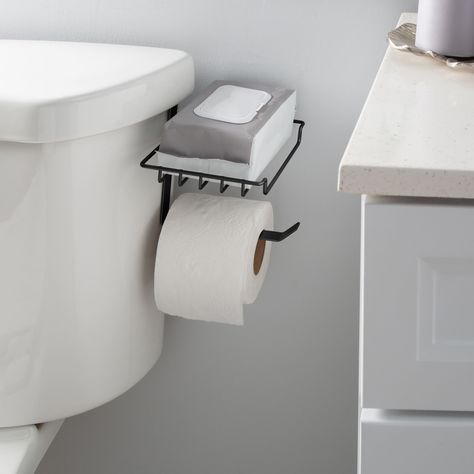 "Find the Bath Bliss Black Over the Tank Tissue Dispenser & Wipe Holder at Michaels. com. This innovative dispenser features an over the tank mechanism, allowing for easy installation without the need for drilling or additional hardware. Simply hang it over the tank of your toilet, and you're good to go. Designed with practicality in mind, your toilet paper is always within arm's reach, ensuring a seamless bathroom experience. This innovative dispenser features an over the tank mechanism, allowi Bathroom Wipes Holder, Funny Toilet Paper Holder, Tiny House Storage Ideas, Toilet Closet, Stacked Laundry Room, Wipe Holder, Guest Bathroom Decor, Bathroom Toilet Paper Holders, Tiny House Storage