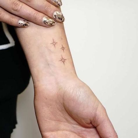 Inner Wrist Star Tattoo, Tiny Stars Tattoo Wrist, 3 Sparkles Tattoo, 3 Small Stars Tattoo, Pretty Star Tattoos, Tiny Star Tattoos For Women, Stars On Wrist Tattoo, Four Point Star Tattoo, Star Fine Line Tattoo