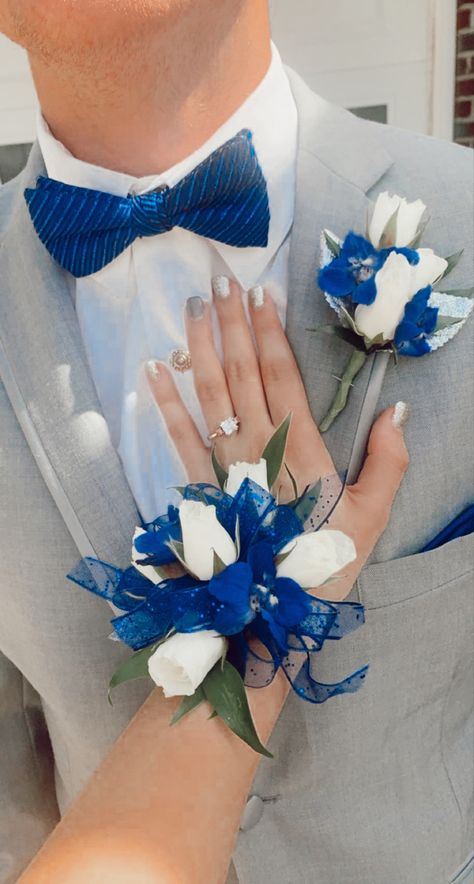 Royal Blue And Silver Chambelanes, Prom Silver Dress Couple, Royal Blue And Grey Prom Couple, Prom Corsage Royal Blue, Senior Prom Tux Ideas, Royal Blue Prom Dress Jewelry, Royal Blue Prom Dress With Grey Suit, Royal Blue And White Prom Couple, Corsages For Royal Blue Prom Dress