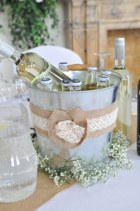 Ice buckets as table centrepieces, burlap/hessian and lace added. Gypsophila added around the base to finish! Wedding Ice Bucket, Bucket Wedding, Bucket Centerpiece, Rooftop Wedding Venue, Hanging Centerpiece, Wedding Table Decorations Centerpieces, Mini Wedding Cakes, Beer Bucket, Champagne Bucket