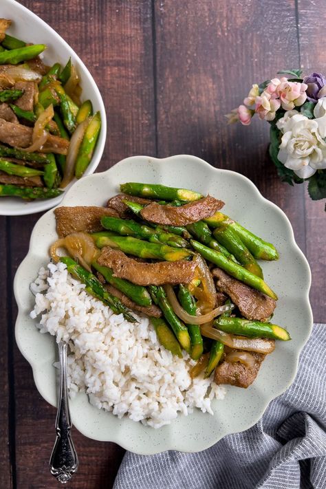 This quick and easy Pork and Asparagus Stir-fry takes less than 15 minutes to make! The tender and moist pork and tender-crisp asparagus dish is a perfect dinner idea for a busy weeknight meal. Pork Asparagus Stir Fry, Pork And Asparagus Recipes, Pork Asparagus, Crisp Asparagus, Asparagus Stir Fry Recipes, Asparagus Stir Fry, Asparagus Dishes, Asparagus And Mushrooms, Perfect Dinner