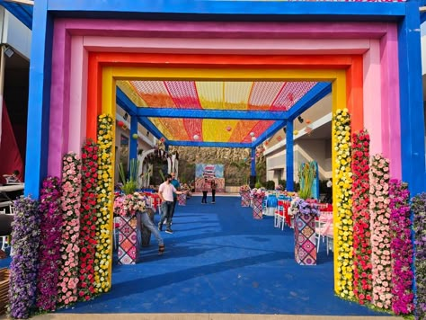 Grand Haldi & Mehendi carnival Rainbow Entrance Decoration, Haldi Entry Gate Decor, Carnival Entrance Decor, Carnival Theme Entrance, Carnival Entrance Ideas, Colorful Haldi Decor, Carnival Mehendi Decor, Carnival Decorations Ideas Entrance, Carnival Theme Mehendi Decor