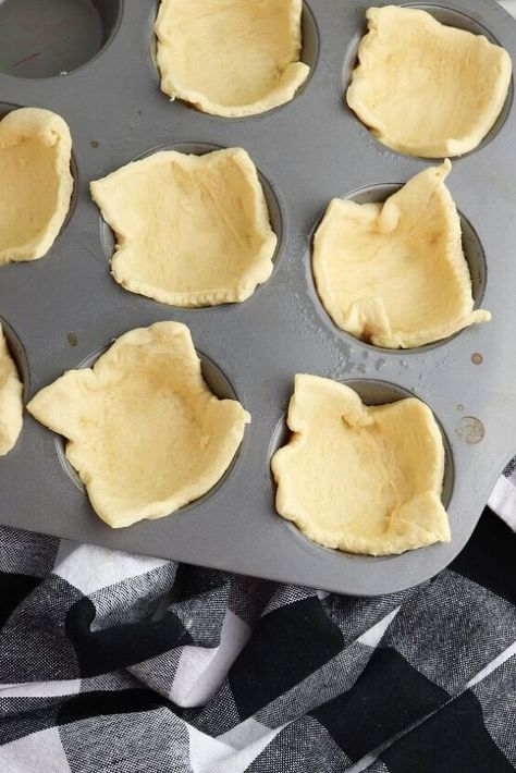 are fun and easy to make for any holiday party. These mini crescent dough cups are filled with chicken pot pie filling and baked. They are the perfect bite-sized appetizer to hand out at Thanksgiving. Your family and friends will love them! Chicken Pot Pie Crescent Rolls These individual chicken pot pies are made by placing the crescent dough in the cups of a muffin tin to use as the crust and then filling them up with the pot pie mixture and baking in the oven. Instead of making an… Mini Pot Pies Crescent, Pot Pie Crescent Rolls, Chicken Pot Pie Crescent Rolls, Recipe With Crescent Rolls, Individual Chicken Pot Pies, Crescent Roll Crust, Mini Pot Pies, Easy Chicken Pot Pie Recipe, Chicken Pot Pie Filling