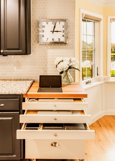 Designing Your Dream Kitchen for Ultimate Convenience | CHD Interiors | Home Furnishings & Accessories – Antiques – Fabrics, Floors & Walls Kitchen Countertop Organization, Kitchen Innovation, Countertop Organization, Phone Store, Popular Kitchens, Charging Stations, Custom Storage, Creative Storage, Command Center