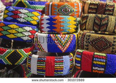 Local craft market in South Africa. Unique handmade colorful beads  bracelets, bangles. Craftsmanship. African fashion. Traditional ornament, accessories. - stock photo South African Jewelry, African Bangles, Colorful Bead Bracelets, African Crafts, Traditional Ornaments, African Market, Africa Art, African Baskets, Craft Markets