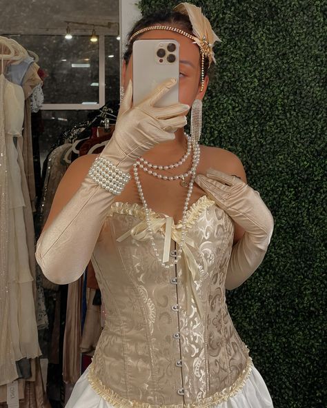 Outfit #7: let’s keep it classic, we all wanna dress up as a 19th century Victorian Damsel 🤩 (aka Gatsby) ✨ Champagne Victorian Corset: XS, S, M, L White Puffy Mini Skirt: XS, S, M, L 🥂 1920 bundle: (gloves, head piece, bracelet, pearl necklace). Nude Glimmer Stockings: Available 💛 1920 Gatsby, Victorian Corset, Bracelet Pearl, Victorian Clothing, Head Piece, Gatsby, Headpiece, 19th Century, Mini Skirt