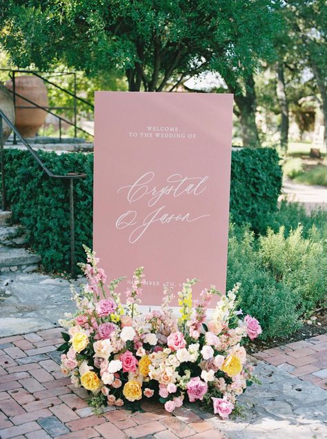 Unstructured Floral Arrangements Wedding, Welcome Sign With Florals, Welcome Wall Wedding, Wedding Signs Colorful, Floral Arrangement Color Palettes, Large Wedding Welcome Sign, Floral Wedding Welcome Sign, Pastel Wedding Signage, Spring Wedding Welcome Sign