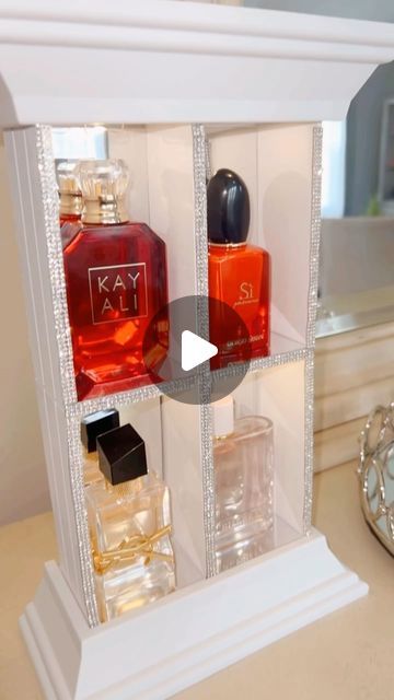 Kendra Davis on Instagram: "😍DIY countertop perfume organizer😍

Hey-hey L♥️VES!

Check out this countertop perfume organizer I made. 

I used 4 wooden craft boxes , 2 floating shelves and a battery operated string light (all from the Dollar Tree). 

I trimmed the piece with self adhesive rhinestones and put flexible mirror sheets on to like to inside ♥️

This was a very simple and in inexpensive DIY/craft. Let me know what you think ☺️.

#diy #dollartreediy #diycrafts #dollartreecrafts #diydecor #diyhonmedecor #diyideas #organizer" Diy Perfume Display, Dollar Tree Makeup, Diy Countertop, Wooden Box Crafts, Makeup Vanity Decor, Perfume Organizer, Craft Boxes, Battery Operated String Lights, Perfume Display