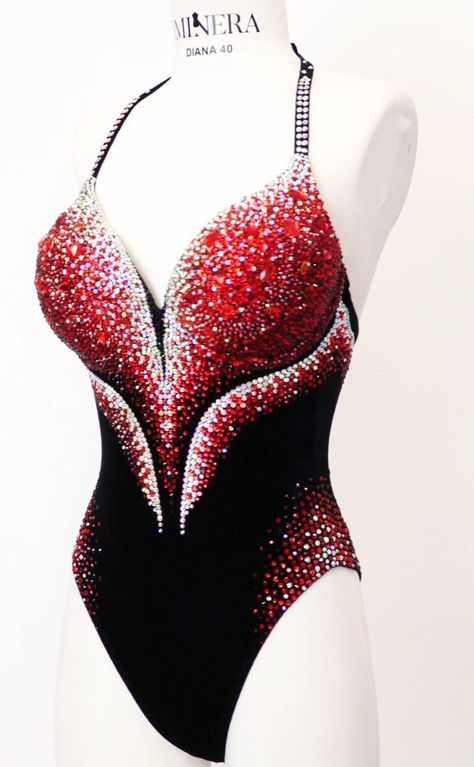 This bodysuit showcases an array of small rhinestones ranging from ruby red to transparent white, accentuated by the addition of large crystals, all set against a backdrop of luxurious black velvet. The meticulous arrangement of these rhinestones forms a captivating and opulent design, combining the allure of rich, dark velvet with the shimmer of the rhinestones. Production time excluding delivery: finished design - 4-5 weeks; custom design 2-3 months. -------------------------------------------