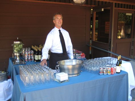 Bartender Mike ready to go! This is a wine/beer bar setup. Bartending Table Set Up, Bartender Set Up Party Ideas, Bar Setup For Party, Wedding Alcohol Bar, Serpentine Tables, Rehearsal Dinner Themes, Paella Party, Bartender Set, Disney Sweet 16