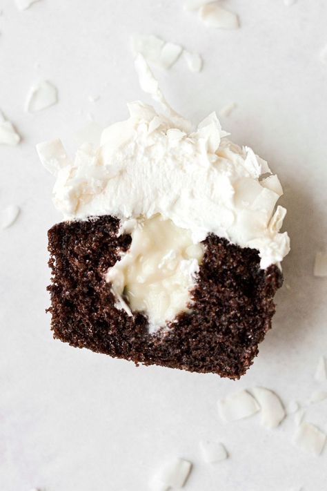 Soft and moist chocolate coconut cupcakes, filled with homemade coconut milk custard, and frosted with fluffy coconut buttercream. This is a high altitude tested cupcake recipe, completely made from scratch with no boxed cake mix! Coconut Cupcake Filling, Coconut Cream Filling For Cake, Coconut Cupcakes From Cake Mix Boxes, Coconut Frosting Recipe, Coconut Milk Custard, Coconut Cream Cupcakes, Chocolate Coconut Cupcakes, Coconut Cupcake Recipes, Chocolate Coconut Cake