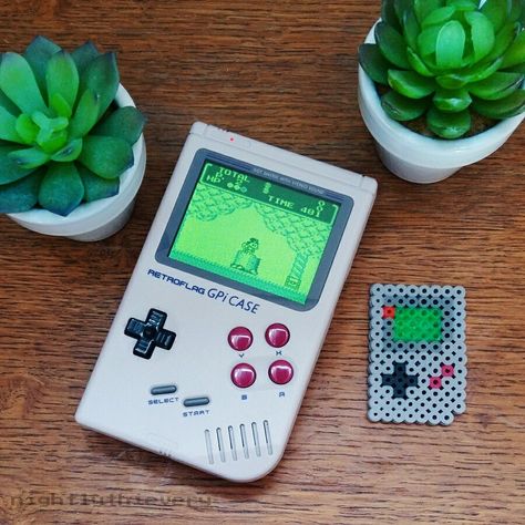 Cute little Nintendo Gameboy DMG Pixel Art made of Melty Beads. You can use this photo as a free pattern to create your own pixel art with fuse beads (Artkal, Hama, Perler) or any other pixelart medium of your choice. Save this pin to your DIY Decor or Arts and Crafts board and share a photo if you give it a try! 😊 There are more free pixelart templates on my Instagram page and my Pinterest boards. Melty Beads, Fuse Beads, Perler Beads, Gaming Products, Nintendo, Pixel Art, Free Pattern, Create Your Own, Diy Decor