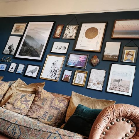 Navy Wall Living Room, Navy Gallery Wall, Navy Blue Gallery Wall, Gallery Wall Blue Paint, Gallery Wall On Dark Green Wall, Dark Blue Wall Green Sofa, Blue Gallery Wall, Picture Frames On Dark Blue Wall, Gallery Wall On Dark Blue Wall