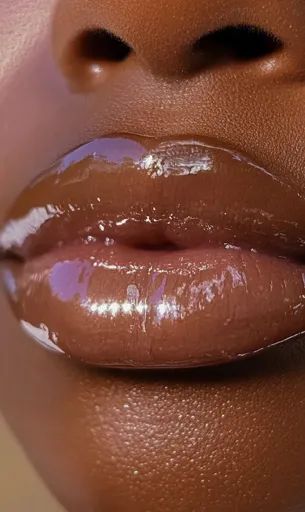 ↑↑↑ Larger size on website 🔸 A close-up of a person's lips with a glossy, light brown lip gloss. The gloss is reflective and crea Lips Eating, Brown Lip Gloss, Brown Lips, Eating Chocolate, January 2025, Glossy Lips, Pink Lips, Brown Color, Light Brown