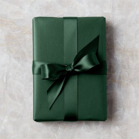 Dark green double-faced satin ribbon sports a lustrous sheen on both sides. Looks especially festive and chic when paired with our dark green gift wrap for a tonal effect. CB2 exclusive.  -Satin -1.5andamp;quot; wide -10 yards -Made in Vietnam Dark Green Holiday Ribbon Gold Wrapping Paper, Green Wrapping Paper, Modern Christmas Ornaments, Black Wrapping Paper, White Christmas Ornaments, Modern Christmas Decor, Christmas Stocking Holders, Holiday Ribbon, Glass Christmas Tree Ornaments