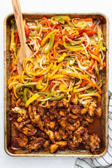 Sheet Pan Chicken Fajitas with less than 10 ingredients! This is made with chicken thighs, peppers and onions, and homemade fajita seasoning. Boneless Skinless Chicken Thigh Fajitas, Sizzling Fajitas At Home, Chicken Thigh Fajita Recipe, Fajita Peppers And Onions, Oven Fajitas Chicken Sheet Pan, Oven Fajitas Chicken, Chicken Thigh Fajitas, Chicken Fajitas Oven, Fajita Burrito