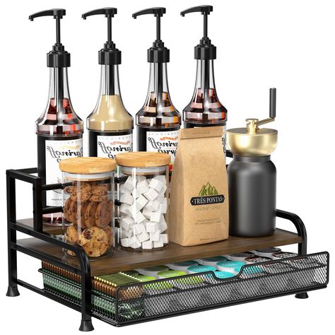 PRICES MAY VARY. [ All-in-One ] Our 3-tier coffee syrup organizer can stand 8 syrup bottles (25.4 oz/750ml) and has a pull-out basket that can store 35 coffee capsules. Stepped design allows for neat placement and easy access to your favorite syrup. Measuring 16" X 9" X 11" with shelves 3.3" and 6" deep. [ Sturdy and Stable ] Our coffee syrup rack is crafted with a sturdy metal frame and solid wood base to ensure stability and load-bearing. Top floor has anti-fall railings to protect bottles. Co Cute Countertop Decor, Cocktail Coffee Bar, Coffee Station Accessories, Coffee Drawer Organizer, Small Coffee Bar On Countertop, Spa Coffee Bar, Victorian Coffee Bar, Apartment Decorating Coffee Bar, Coffee Bar Industrial