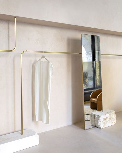 This Agnes Martin–Inspired Boutique Takes Nude Tones to New Levels - Sight Unseen Agnes Martin, Pink Mirror, Large Chandeliers, Clothes Rack, Grey Glass, Display Design, Pink Marble, Shop Interior, Clothing Rack