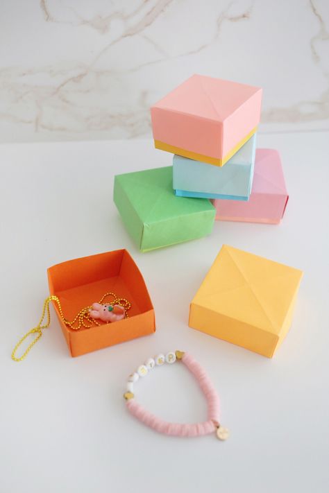 How to Make an Origami Box (with video!) - Childhood Magic Paper Origami, Paper Boxes, Origami Box, Perfect Squares, Small Gift Boxes, Box With Lid, Instructional Video, Origami Paper, Small Gift