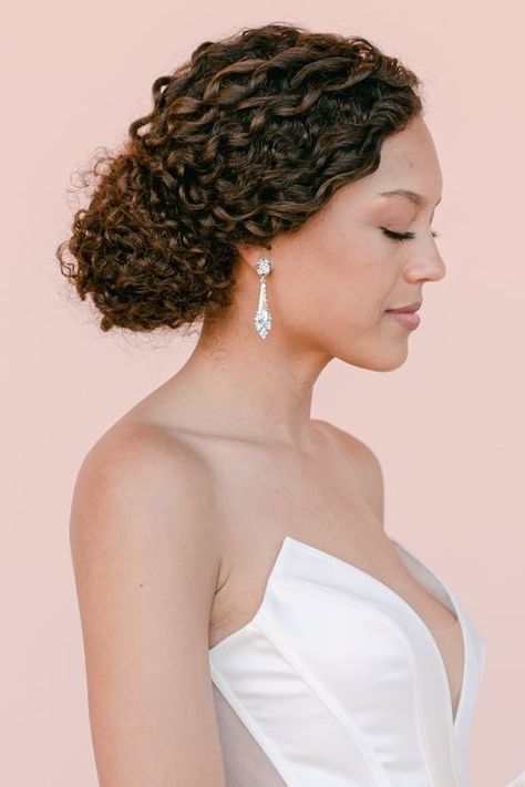 From braided chignons to twisted knots, low buns are the quintessential hairstyle for a classic and modern aesthetic. Here, we've rounded up 10 stunning low bun styles to inspire your own. Curly Bun Bridal Hair, Low Bun Styles, Low Bun Wedding Hairstyles, Bun Wedding Hairstyles, Bun Wedding, Braided Chignon, Low Buns, Side Updo, Natural Wedding Hairstyles