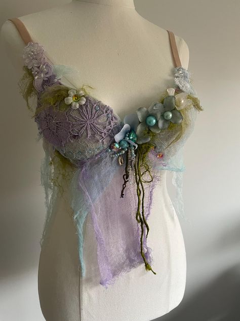 Beautiful Ethereal Mer Fae Fairy tale top! With a tiny key to a far away cave where the Mer folk dwell. Size 10B What started as a plain new push up bra became something ripped from the Ethereal world of fairies and mermaids! Feel beautifully different in this imaginative fairy tale textile art to wear top. Made by myself with love, many hours of work and a huge imagination. Embellished with creative magic. A unique, rustic, delicate, romantic top that will transport you to a world of imaginatio Shell Top, Mermaid Clothes, Water Inspired Outfits, Faerie Aesthetic Clothes, Fairy Top, Mermaid Inspired Outfits, Fashion Show Themes, Mermaid Top, Mermaid Bra