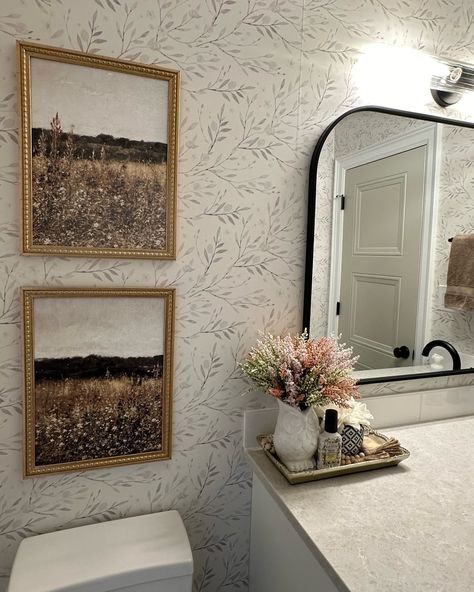 Wait is this not the cutest bathroom?! @shaylaackerman created the most beautiful space with our peel and stick wallpaper! This design is perfectly neutral and suits all home decor styles including both vintage and modern! ✨ Linked in stories. Neutral Floral Wallpaper Bathroom, Bathroom Spa Wallpaper, Sticky Wallpaper Bathroom, Wallpaper In Bathroom With Shower, Neutral Bathroom With Wallpaper, Wallpaper For Grey Bathroom, Accent Wall Restroom, Peel And Stick Wallpaper Bathroom Accent Wall, Bathroom Wallpaper Half Wall