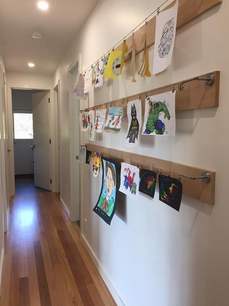 Weekend project! (seen on google images originally). An art wall in the children's hallway. We used some left over Tassie oak pieces which we sanded. Then we attached the IKEA Dignitet Curtain Wires ($12.99 a set) plus some IKEA Riktig curtain hooks ($4 pack). Ikea Curtain Wire, Ikea Dignitet, Curtain Wire, Displaying Kids Artwork, Basement Playroom, Kids Artwork, Weekend Projects, Artwork Display, Display Storage