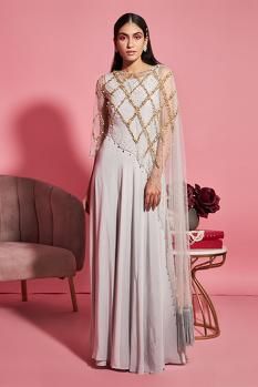 Buy Sanya Gulati Grey Net Gown With Embroidered Asymmetric Cape Online | Aza Fashions Cape Dress Indian, Asymmetrical Cape, Burgundy Gown, Cape For Women, Grey Gown, Indian Bridesmaids, Net Gowns, Diwali Outfits, Grey Jumpsuit