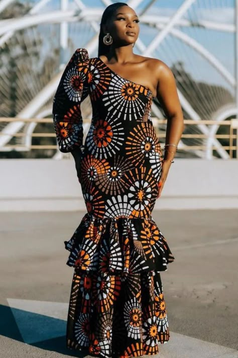 A lady wearing an  long ankara gown Trending Ankara Gowns, African Glamour, Dinner Wears, Afro Design, Long Dress African, Styles For Summer, Ankara Long Gown Styles, African Outfits, Best African Dresses