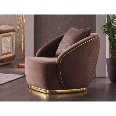 Our new armchair is the perfect addition to any home décor with its stylish gold details and comfortable design. This armchair comes with a pillow on the back, ensuring maximum comfort and relaxation. This armchair is designed to match any interior décor. Whether you're looking for a cozy spot to curl up with a good book or a stylish statement piece to add to your living room, this armchair is a perfect choice. The gold details of the armchair give it an elegant and sophisticated look, adding a Gold Interior Design, Elegant Lifestyle, Cozy Spot, Linen Armchair, Upholstered Armchair, Swivel Barrel Chair, Gold Interior, Deco Furniture, Velvet Armchair