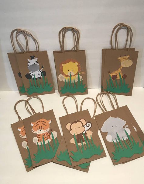 These adorable Safari favor bags are a special addition to your safari themed party They are great for candy table decoration, and they make special thank you party favor. 12 Goodie Bags (2 of each character) Bags are 8”H (without handles) X 5” W Jungle Theme Birthday Party, Zoo Birthday Party, Jungle Thema, Wild Birthday Party, Baby Shower Gift Bags, Jungle Theme Birthday, Jungle Birthday Party, Safari Theme Birthday, Zoo Birthday