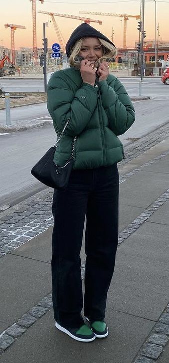 a green puffer jacket with black pants, a black shoulder bag, and black and green air jordan 1's Outfits With Puffer Jackets, Puffer Jacket Outfit Aesthetic, Green Puffer Jacket Outfit, Puffer Jacket Aesthetic, North Face Puffer Jacket Outfit, Puffer Jacket Outfits, Green Jacket Outfit, Puffer Outfit, Puffer Jacket Outfit