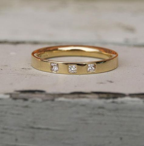 18ct recycled yellow gold band  flush set with three princess cut square diamonds. A princess cut half eternity band.Each diamond is 1.5mm square , 0.07ct total and the gold band is 2.5mm wide. If you would prefer a wider band or one in a different metal just ask for a quote.Made to order in your size, orders take 3-4 weeks.For other eternity and diamond bands go towww.karenjohnsondesign.etsy.comor facebook.com/karenjohnsondesign Diamond Gold Band, Flush Set Diamond, Garnet Ring Silver, Amethyst Ring Engagement, Three Stone Diamond Ring, Topaz Engagement Ring, Opal Ring Gold, Rose Gold Diamond Ring, Best Engagement Rings