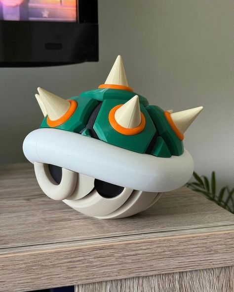 This Bowser's shell isn't just cute room decor, it's got storage space for up to 20 switch gam too. Link in bio https://geekygifting.com/gifts-for-nerds #geekygifting #gaggifts #coolgifts #geekgifts #giftideas #giftsfornerds #geekstuff #geeked #nerdgifts #coolgadgets #geekystuff #bowser #mariokart #memes #memesdaily 3d Printed Games, Diy Bowser Shell, Cool Items To Buy, 3d Print Gifts, Mario Shell, Bowser Shell, 3d Print Ideas, 3d Printed Decoration, Nerdy Gifts For Him