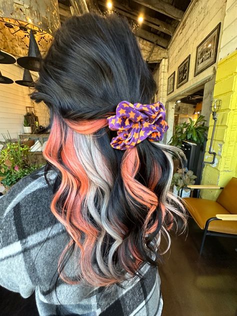 Black Hair With Orange And Purple Highlights, Dark Brown Hair With Bright Colors, Dark Fun Hair Color Ideas, Black Orange Blonde Hair, Blonde Halloween Hair, Halloween Themed Hair Color, Orange Black And Blonde Hair, Spooky Season Hair, Halloween Inspired Hair Color