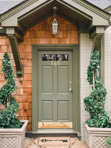 Enhance curb appeal with one of these trending front door colours Green Wooden Front Door, Front Door Sage Green, Clary Sage Front Door, Sage Front Door Brick House, Muted Green Front Door, Sage Green Doors Exterior, Sage Green Front Door Colors, Sage Front Door, Sage Green Composite Front Door