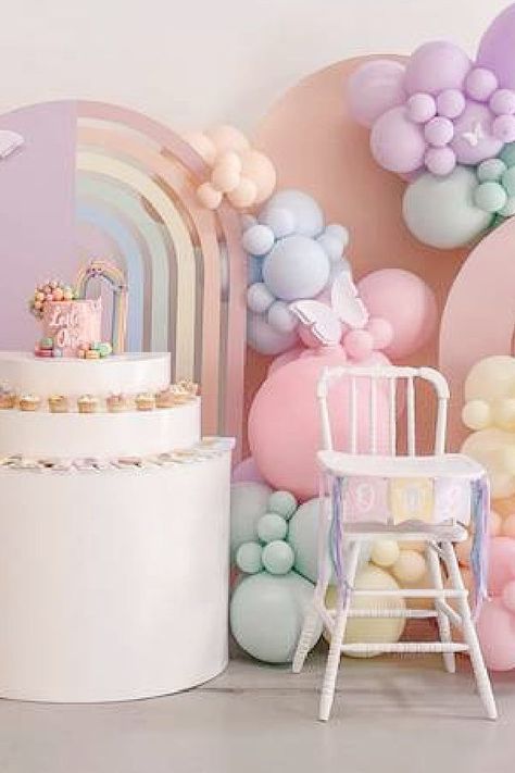 Take a look at this gorgeous pastel rainbow birthday party! The highchair is so cute!! See more party ideas and share yours at CatchMyparty.com Pastel Rainbow One Year Old Party, Pastels Theme Party, Pastel Colour Birthday Theme, Pastel One Year Old Birthday, Pastel Colors Birthday Theme, Rainbow One Year Old Party, Pastel Rainbow Balloon Garland, Pastel Color Birthday Party Ideas, Pastel 1st Birthday Girl