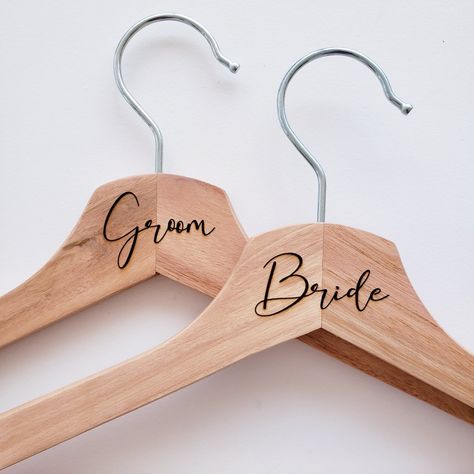 Beautiful natural wood hangers with bride or groom engraved with laser Coat Hanger Diy, Bride Coat Hanger, Bridal Coat Hangers, Bride Coat Hangers, Groom Hanger, Wooden Hanger Bride, Bridesmaid Wooden Hangers, Wooden Coat Hanger, Bride Hanger Personalized Cricut