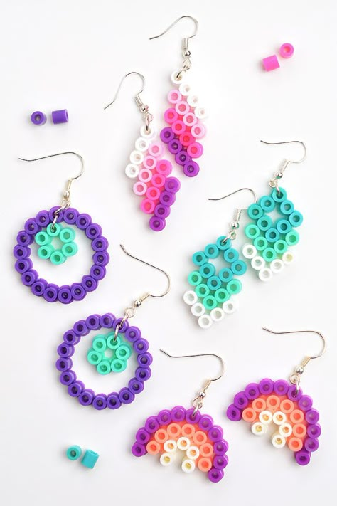 These Perler bead earrings with free printable patterns are SO CUTE and fun to make! Use our templates or design your own and make a pair of DIY earrings in less than 15 minutes. It's a fun activity for summer camp or sleepovers and such a cool craft for kids, tweens, teens, and adults! Earrings Made With Beads, Earring Perler Beads, Easy Diy Earrings Ideas, Bead Earrings Ideas Diy Jewelry, Pearler Bead Earrings Diy, Perler Earrings Diy, Mini Perler Bead Patterns Cute, Perler Bead Earring Holder, Perler Bead Crafts To Sell