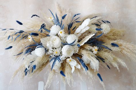 Dusty Blue White Flower Arch Arrangement,Boho Wedding Arch Flower,Faux Flower Wedding Arrangement,Navy Blue Wedding Arch Flower,Wedding Arch 🎈🎈Because the size of the arch flower is large, we usually pack the palm leaves and Pampas grass separately. When you receive them, please insert them according to the picture, which can effectively avoid damage to it during transportation, please understand. 💖Gorgeous wedding corner swag!💖 Contains natural pampas grass and palm leaves, as well as beaut Dusty Blue Wedding Theme Backdrop, Navy Blue Wedding Theme Decoration, Dusty Blue And Sand Wedding, Blue Wedding Arch, Dusty Blue Boho Wedding, Dusty Blue Wedding Decorations, Flannel Wedding, Boho Wedding Arch, Navy Blue Wedding Theme