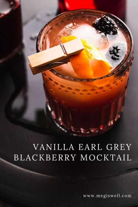 This Vanilla Earl Grey Blackberry Mocktail has delicious currents of vanilla, orange, bergamot, and blackberry and is the perfect mocktail for tea lovers! | Non Alcoholic | Summer Drinks | Shrub Mocktail | #mocktail #megiswell #meganwellsphotography | www.megiswell.com Tea Cocktails Non Alcoholic, Pitcher Of Mock Tails, Tea And Alcohol Drinks, Mood Boosting Mocktail, Earl Grey Mocktails, Mocktails For Tea Party, Tea Mocktails Non Alcoholic, Coffee Mocktail Non Alcoholic, Tea Party Drinks Non Alcoholic