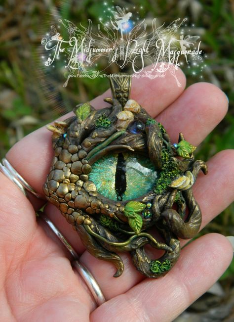 Forest Dragon necklace pendant.   Handsculpted from polymer clay by Megan Johnson, artist and creator of "The Midsummer's Night Masquerade" www.Facebook.com/TheMidsummersNightMasquerade  #dragoneye #polymerclay #jewelry #fantasyart #clayjewelry #dragon #forestdragon Clay Plant Creatures, Polymer Clay Viking, Fantasy Polymer Clay, Dragon Polymer Clay, Fimo Projects, Forest Dragon, Polymer Clay Dragons, Polymer Clay Kunst, Woodland Elf