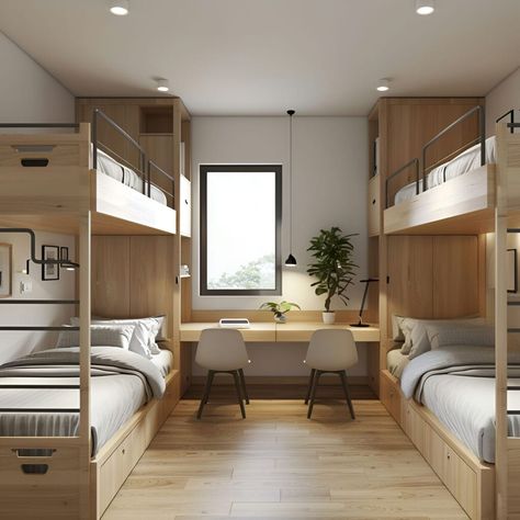 This Scandinavian dormitory room combines functionality and minimalism. It features two sets of wooden bunk beds with built-in storage drawers, maximizing space. A central study area with a long desk and two modern chairs is perfect for academic activities. Natural light floods the room through a large window, highlighting clean lines and simple decor like a potted plant and minimalist lighting, creating a bright and inviting atmosphere. Minimal Bunk Beds, Student Hostel Room Design, Modern Student Housing, Bed Space Ideas Dorm Room, Hostel Room Interior, Dormitory Room Design, Student Dormitory Room, Minimalist Bunk Bed, Bunk Bed Desk