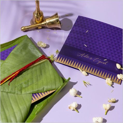 Mubaarak on Instagram: "A celebration of religious offerings that bring auspiciousness and prosperity to every wedding, Vaazhai Pattu ties a beautiful knot of togetherness on every Nyota wrapped in evergreen leaf of banana. #invites #invitations #wedding #weddings #weddinginvitation #weddingcard #weddingstationery #coutureinvitations #custominvitations #luxuryinvitations #wardrobeplanner #indianwedding #nyota #graphicdesign #babyinvitations #dresstoimpressinvite #weddinginspiration #tablestyli Banana Leaf Wedding Invitation, Banana Leaf Invitation, Quirky Wedding Invitations, Leaf Invitations, Wedding Invitations Leaves, Unique Wedding Cards, Couples Monogram, Quirky Wedding, Wedding Invitation Video