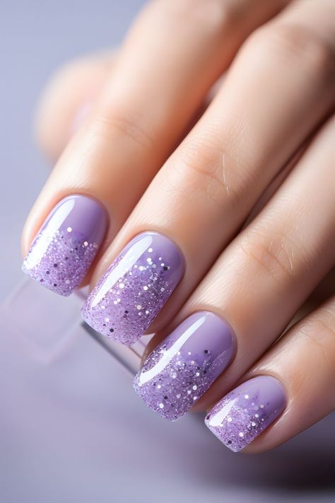 lilac nails, glittery manicure, nail art inspo, purple nails, shiny nail design, trendy nails, festive sparkle, elegant nail ideas, holiday season, glamorous nails, nail inspiration, stylish manicure, nail trends, dazzling nails, nail aesthetics, glittery tips, nail fashion, beauty trends, sparkly nails, nail glam, nail goals, chic nails, lilac sparkle, fabulous nails, nail vibes Nail Ideas Holiday, Elegant Nail Ideas, Glitter Nail Ideas, Nails Lilac, Nail Aesthetics, Lilac Glitter, Nail Vibes, Nail Glam, Nail Goals